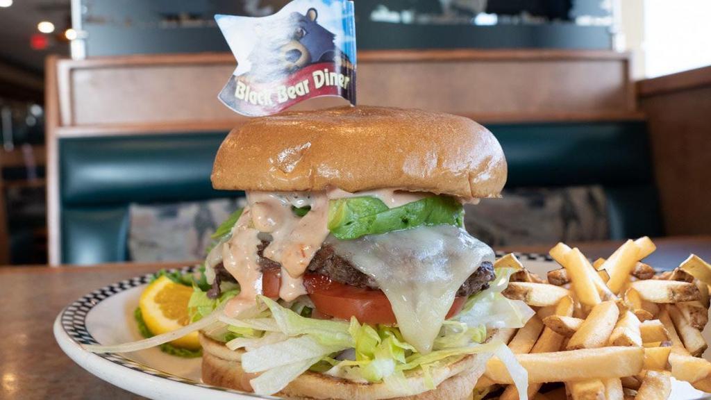 California Burger · A 6 oz. all beef patty built on a golden brioche bun, shredded lettuce, tomato, diced red onion, dill pickle chips, mayonnaise & Thousand Island dressing.  . Topped with Avocado & jack cheese.
