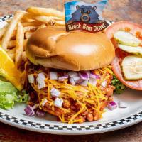 Chili Cheddar Cheeseburger · 6 oz burger topped with chili, cheddar cheese & diced red onion on a grilled brioche bun.  S...