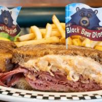 Reuben · Our own corned beef piled on grilled rye with Swiss cheese, sauerkraut & Thousand Island dre...
