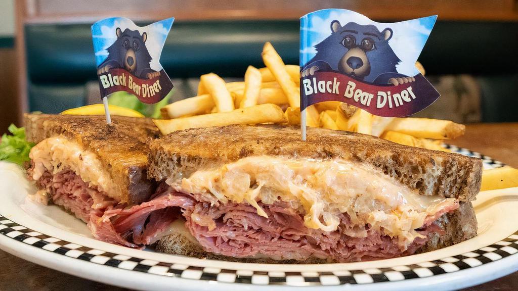 Reuben · Our own corned beef piled on grilled rye with Swiss cheese, sauerkraut & Thousand Island dressing.