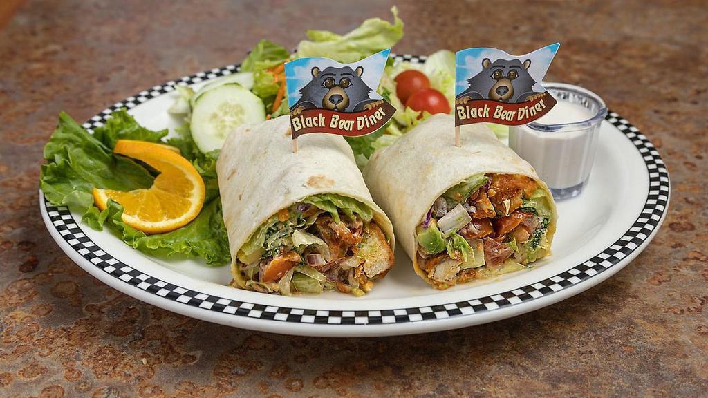 Crispy Chicken Bacon Ranch Wrap · Diced crispy chicken strips tossed with salad mix, red onion, diced tomato, avocado and our housemade Bacon Ranch dressing, wrapped up in a large tortilla.  . Spice it up with Frank's RedHot® Buffalo Sauce!