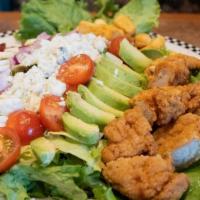 Crispy Chicken Cobb Salad · Salad mix topped with chopped crispy chicken tenders, cherry tomato, crispy bacon, hard-boil...