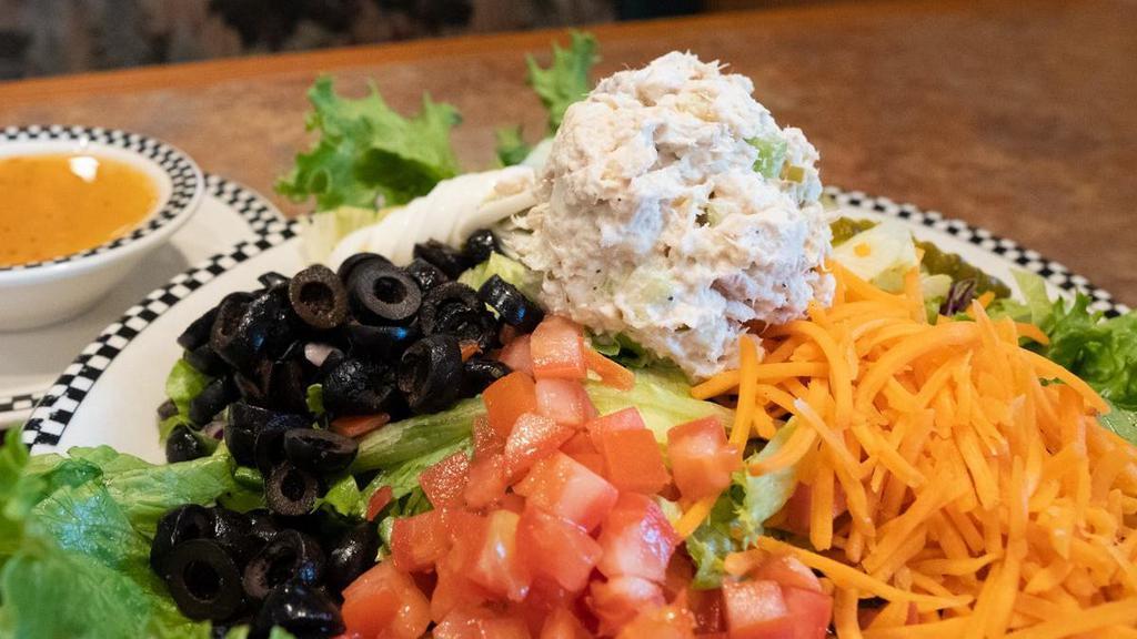 Tuna Chef Salad · Salad mix, hard-boiled egg, cucumber, carrot, olive, tomato & pickle chips topped with housemade Albacore tuna salad and served with Italian dressing.