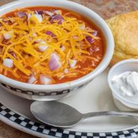 Bowl Of Chili · A red chili that includes pinto beans, ground beef, our housemade Mild Italian sausage, toma...