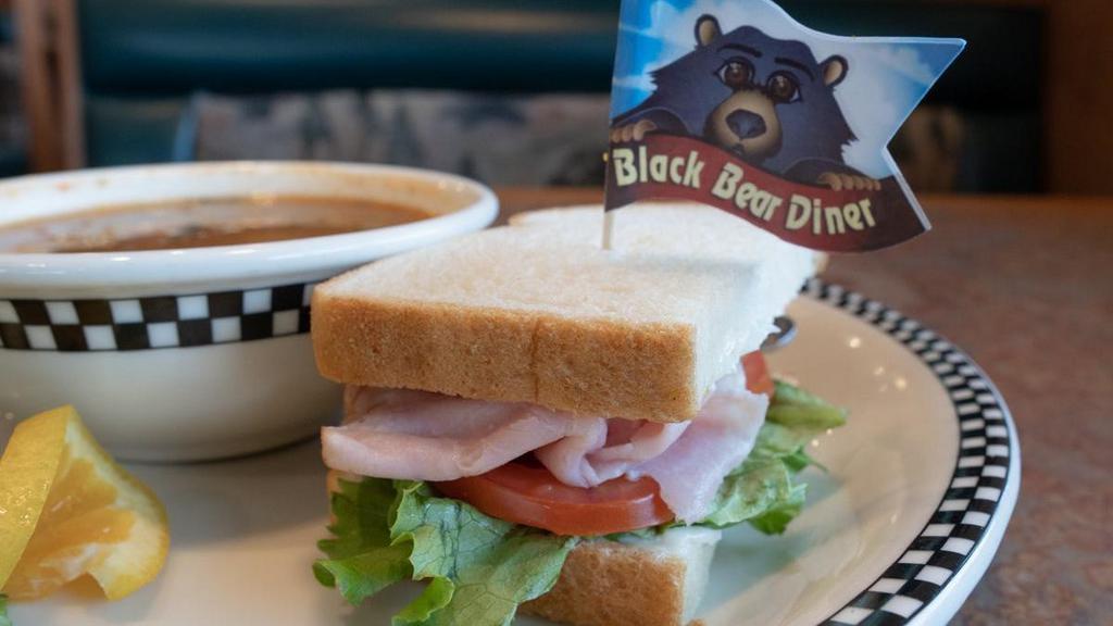 ½ Sandwich & Bowl Of Soup · Choose from a ham, turkey, Albacore tuna salad or Waldorf chicken salad sandwich. Served with tomato, green leaf lettuce, mayonnaise & the soup of the day.