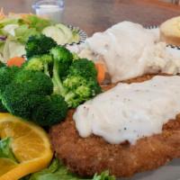 Bigfoot Chicken Fried Steak · Our best-selling item. Tender beef, breaded. then deep-fried & smothered in our own. country...