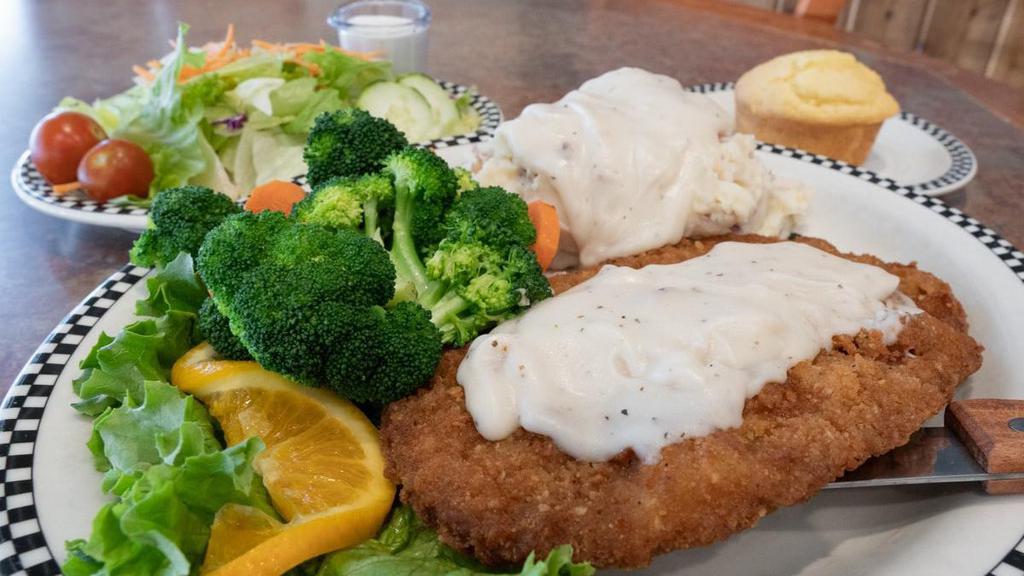 Bigfoot Chicken Fried Steak · Our best-selling item. Tender beef, breaded. then deep-fried & smothered in our own. country gravy..