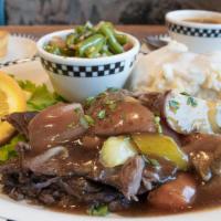 Slow-Cooked Pot Roast · A tender traditional favorite. Slow-roasted with vegetables, herbs & spices and finished wit...