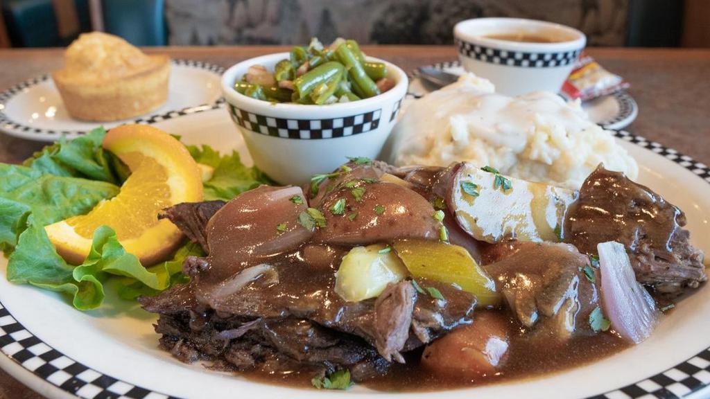 Slow-Cooked Pot Roast · A tender traditional favorite. Slow-roasted with vegetables, herbs & spices and finished with beef gravy.