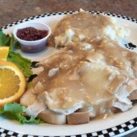Open-Faced Hot Turkey  · Roasted turkey breast served open-faced on sliced white bread with red-skinned mashed potato...