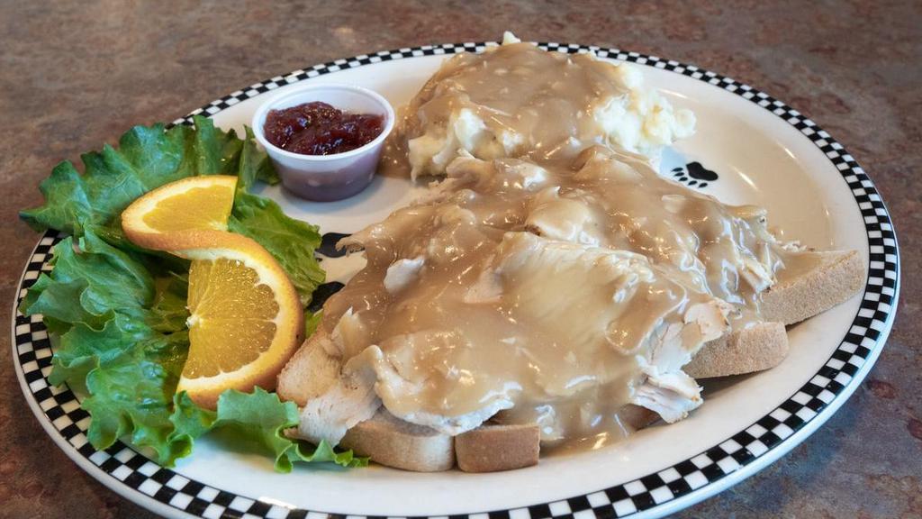 Open-Faced Hot Turkey  · Roasted turkey breast served open-faced on sliced white bread with red-skinned mashed potatoes, turkey gravy & cranberry sauce.