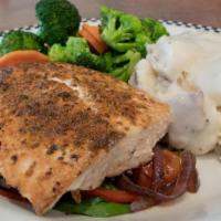 Blackened Salmon · Cajun seasoned, grilled salmon fillet served on a bed of sautèed spinach and cherry tomato. ...