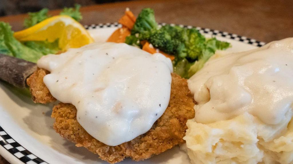 Bear Paw Chicken Fried Steak · Tender beef, breaded then deep-fried & smothered in our own country gravy..