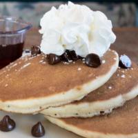 Cubs’ Chocolate Chip Pancakes · 3 of our yummy pancakes loaded with chocolate chips. Sprinkled with powdered sugar and toppe...