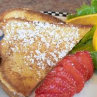 Cubs' Strawberry French Toast · One slice of thick-cut sourdough French toast topped with whipped cream.  Served with sliced...