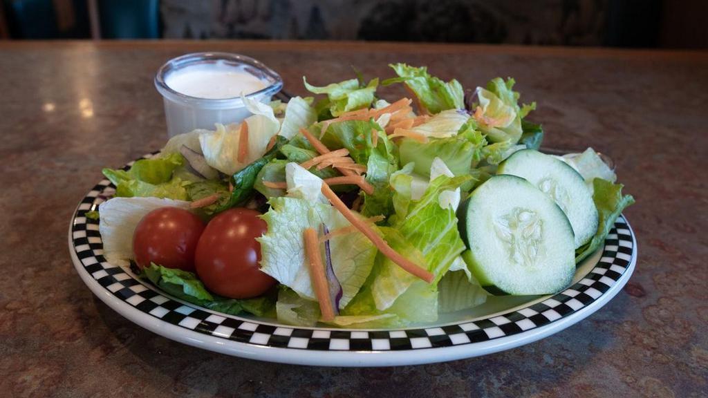 Dinner Salad · Salad mix topped with cherry tomato, cucumber and carrot.  Served with your choice of dressing.