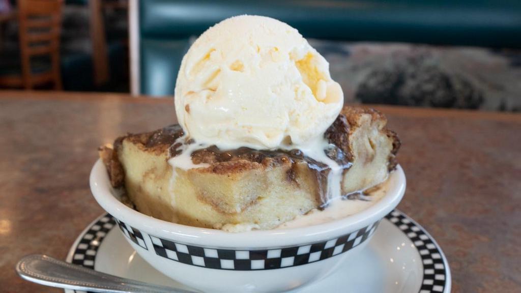 Olga'S Bread Pudding · Made with bread, heavy whipping cream, eggs and vanilla, then served warm with a scrumptious pecan praline sauce and whipped cream. If you have never tried bread pudding, this is the one that will make you a believer – it’s ‘awe’some!