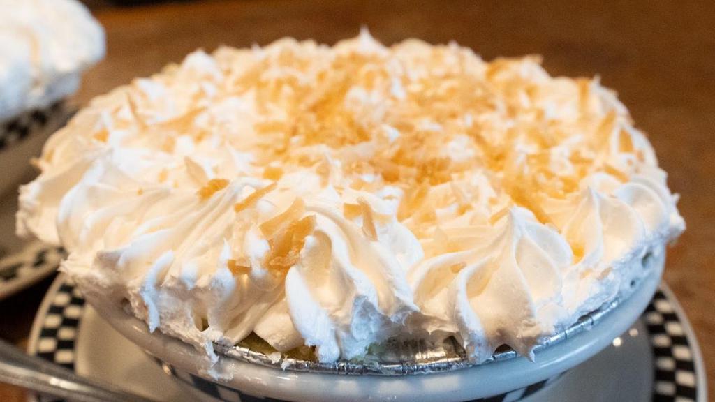 Coconut Cream Pie · Decadent coconut cream in a buttery graham cracker crust.  Topped with whipped cream and toasted coconut flakes.