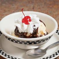 Hot Fudge Sundae · Hot Fudge Sundae with vanilla ice cream, whipped cream, nuts & maraschino cherry.