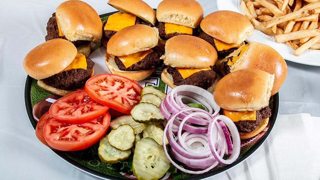 Cheeseburger Sliders & Fries · Nine cheeseburger sliders served with a mountain of fries, lettuce, tomato, onion, pickles and housemade thousand island dressing.