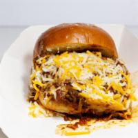 Magic Chili Burger · Fresh homemade chili, topped with Cheddar cheese.