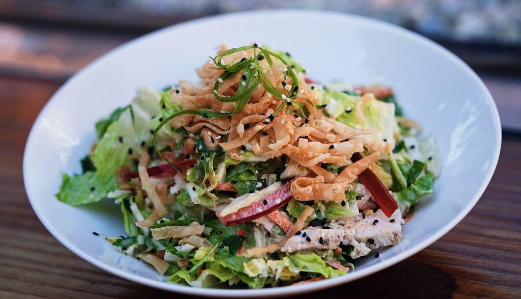 Asian Chicken Salad · Asian slaw, romaine lettuce, cilantro, grilled chicken, miso dressing, fried wontons, sesame seeds, cashews, cilantro (Cilantro cannot be removed as it is premixed into the Asian slaw)