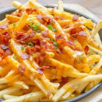 Loaded Fries · Crispy, craveable French fries salted to perfection and topped with cheese and bacon.