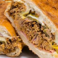 Cubano · pulled pork shoulder, black forest ham, mustard, pickles, aioli and Swiss cheese on grilled ...
