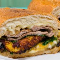 Papito · steak, plantains, caramelized onions, organic arugula, aioli and Swiss cheese on grilled Fre...