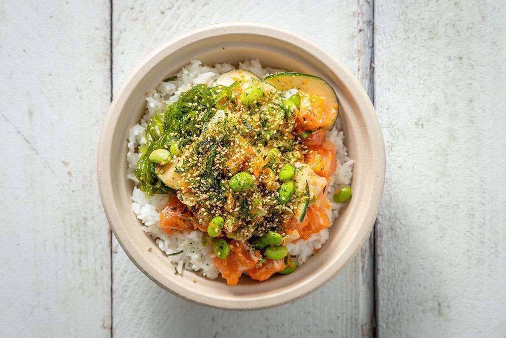 House Salmon Bowl · A Poke House favorite since day one! Combines melt-in-your mouth Scottish salmon with a mix of masago, edamame, cucumber, white and green onions, furikake, ponzu and our house-made sriracha aioli for a mild kick. Served over rice or salad with seaweed salad and crab salad.