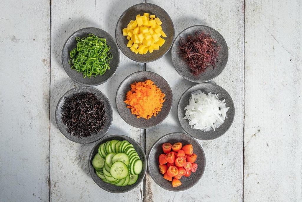 Veggie Bowl · Choose 4 mix-ins combined with sauces, and toppings over rice or veggies.
