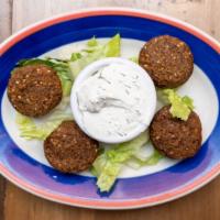 Falafel · Garbanzo beans, fresh parsley, onions and special spices, deep-fried and served with yogurt ...