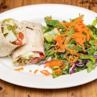 Falafel Wrap · Falafel wrapped in lavash bread with tomatoes, lettuce, and plain yogurt sauce.