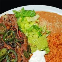 Plato Ranchero · Strips of beef cooked with tomatoes, onions & jalapeños.