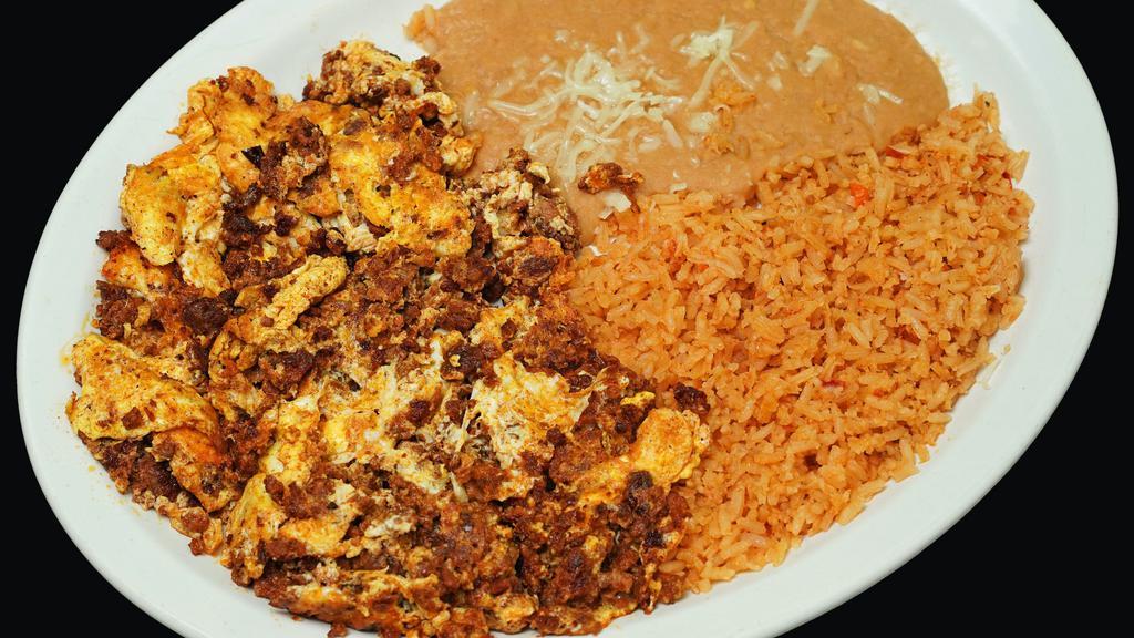 Chorizo & Eggs · Scrambled eggs cooked with chorizo and comes with a choice of flour or corn tortillas.