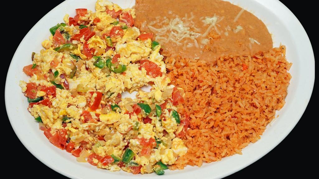 Huevos A La Mexicana · Scrambled eggs cooked with jalapeños, tomatoes, onions.