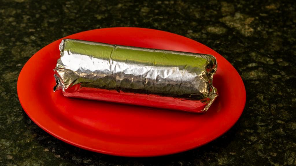 Jumbo Burrito · Includes cheese, rice & beans, salsa, sour cream, guacamole, lettuce & your choice of meat.