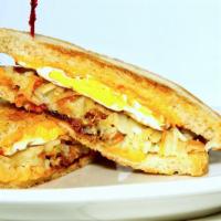 Digger's Famous Breakfast Sandwich · A hearty sandwich made with grilled sourdough, an over hard egg, hash browns, American chees...