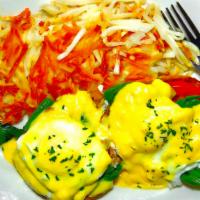 Florentine Benedict · Two poached eggs on grilled English muffin topped with fresh tomatoes, spinach, hollandaise ...