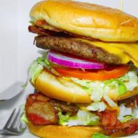 The Coffin Burger · A huge bacon cheeseburger with three buns, two 1/3 pound burger patties and all the fixings,...