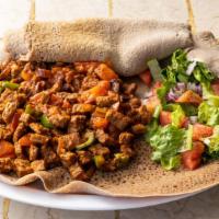 Tibsy Sga · Spicy. A rich spiced Eritrean meat stew. Cubed bread that is stir-fried with beef, lamb saut...