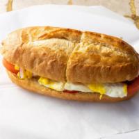 Egg Sandwich · Scramble egg, onion, tomato, and olive oil. Served on wheat slice or roll.