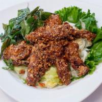 Chicken Wings · Siamese-spiced crispy chicken wings tossed with crushed peanuts and sweet chili sauce.