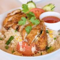 Fried Chicken over Fried Rice · Battered chicken breast, eggs, onions, scallions and tomatoes with sweet and sour dipping sa...