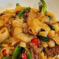 Pad Kee Mao · Stir-fried flat rice noodles, chili, green beans, onions, bell peppers and sweet basil.