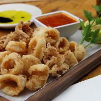 Calamaretti Fritti · Baby squid, lightly floured & deep fried, served with spicy marinara Cal/830.