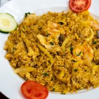 Pineapple Curry Fried Rice  · Rice sautéed in curry with egg, chicken, prawns and pineapple.