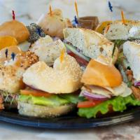 Assorted Sandwich Platter · Assorted sandwiches - choose from turkey club, tuna, chicken salad, veggie, hummus, BLT, and...
