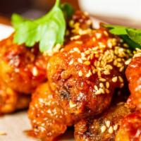 Thai sweet chili wings · Battered fried chicken wings, then flavored with Thai sweet chili sauce.