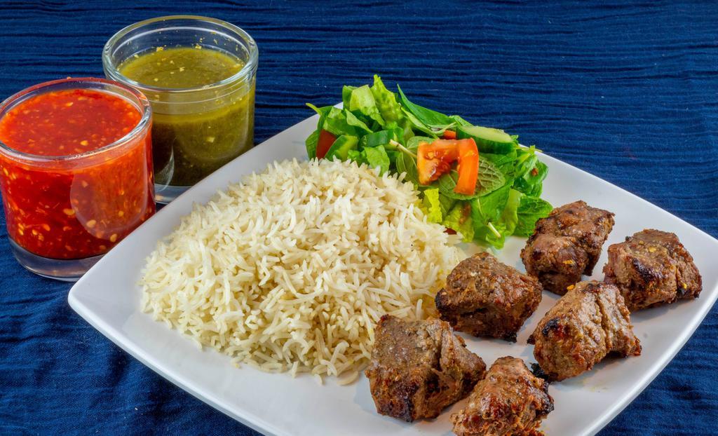 Beef Tikka Kabob · A skewer of freshly grilled chunks of beef tenderloin seasoned in our blend of special spices. Served with rice, naan and a garden salad.